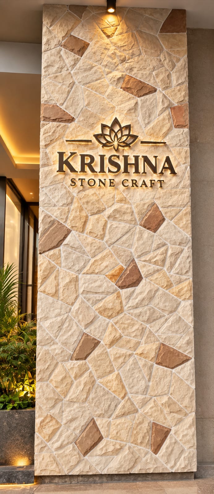 Grand exterior boundary gate pillar finished in rustic sandstone cobble masonry with illuminated emblem
